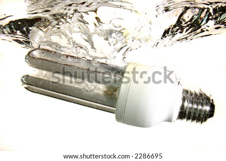 Power-saving lightbulb droped into the water with a splash