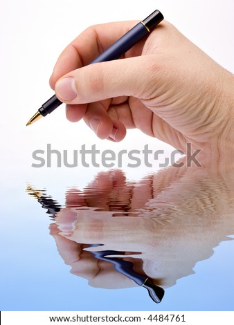 Hand with pen signing on white background. Isolated on white background and reflection