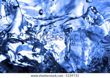 Sparks of blue water on a white background ...