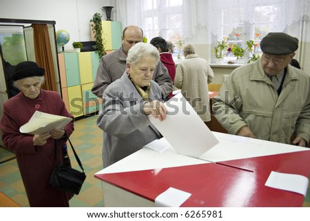 People casting votes in elections in Poland
