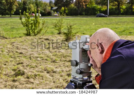 Measuring with theodolite - land surveying