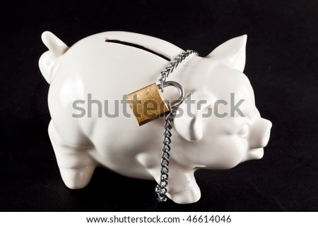 Piggy bank protected by padlock and chain