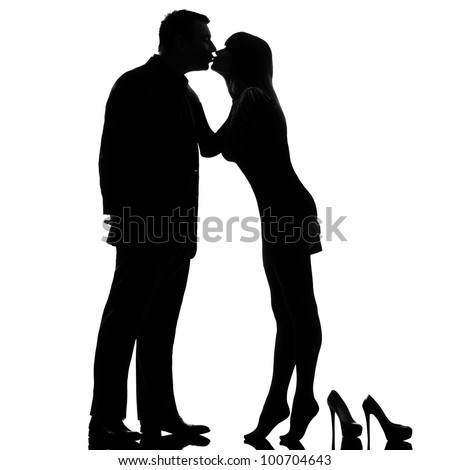 one caucasian couple kissing man and woman barefoot tiptoe full length in studio silhouette isolated on white background