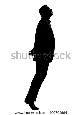 one caucasian business man silhouette standing tiptoe looking up Full length in studio isolated on white background