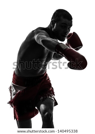 One Caucasian Man Exercising Thai Boxing In Silhouette Studio On White Background