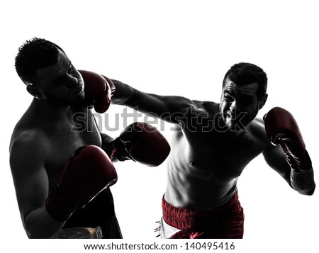 Two Caucasian Men Exercising Thai Boxing In Silhouette Studio On White Background