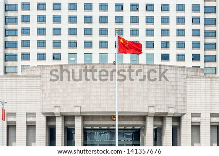 SHANGHAI, CHINA - APRIL 7: official Chinese military government building on people square shanghai in popular republic of china on April 7th, 2013