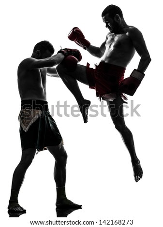 two caucasian men exercising thai boxing in silhouette studio on white background two caucasian men exercising thai boxing in silhouette studio on white background