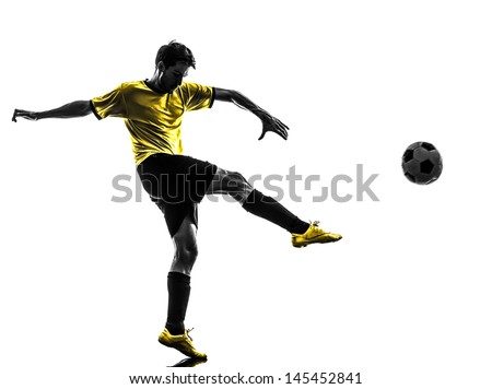 one brazilian soccer football player young man kicking in silhouette studio on white background one brazilian soccer football player young man kicking in silhouette studio on white background