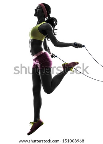 one caucasian woman exercising fitness  jumping rope  in silhouette on white background - stock photo