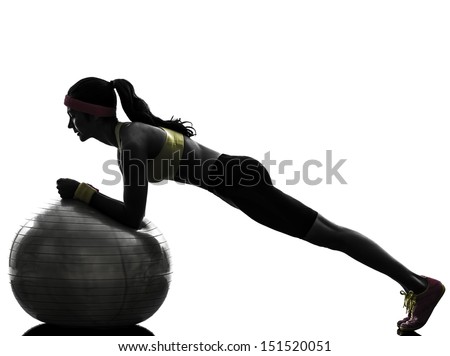 One Woman Exercising Plank Position On Fitness Ball In Silhouette On White Background