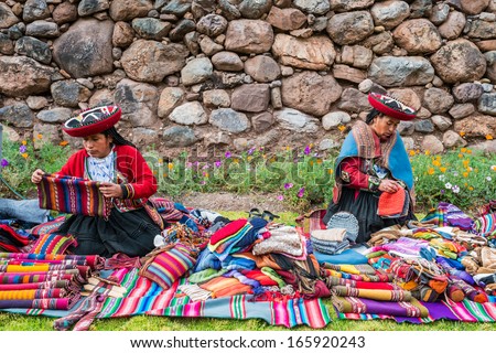 CUZCO, PERU - JULY 15: women selling handcraft in the peruvian Andes at Cuzco Peru on july 15th, 2013. In the Andes of Peru every village has its own weaving patterns and traditions.