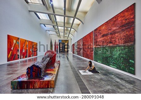 Beijing , China - September 23, 2014 : student painting inside the UCCA in the  798 Art District zone aera in Beijing China