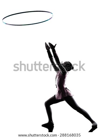 one caucasian little girl child  exercising Rhythmic Gymnastics in silhouette isolated on white background