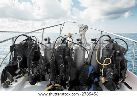 scuba diving equipment on a boat on a sea