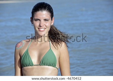 Foto de Sexy stylish brazilian woman in fashion bikini enjoying vacation at  the beach. Black female model with dreadlocks and trikini exotic swimwear.  do Stock