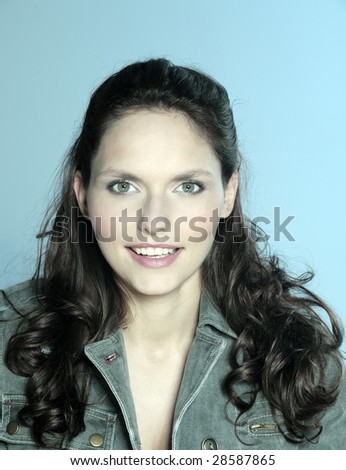 studio shot portrait of a beautiful 25 years old smiling woman
