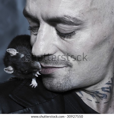portrait studio on isolated background of a strange man with his rat