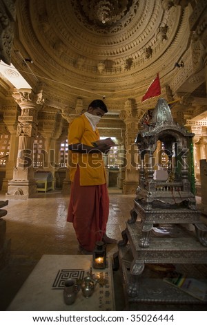 jain priest praying temple of lodruva jaisalmer in rajasthan state in india