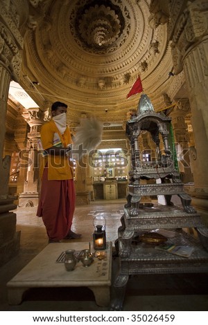 jain priest praying temple of lodruva jaisalmer in rajasthan state in india