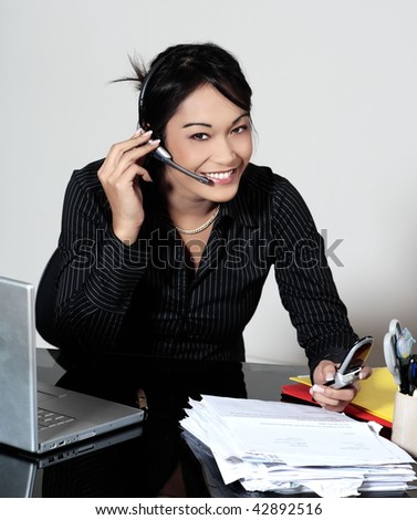 cute funny young expressive women asian working woman at the office calling by phone