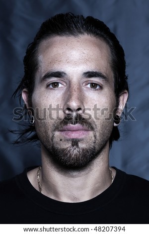 stock photo : urban stylish caucasian young man with pierced ears and