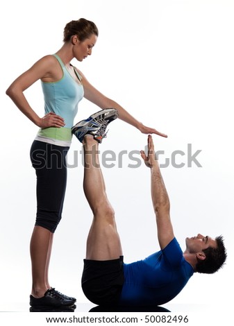 couple,man and woman doing abdominals workout posture on isolated white background