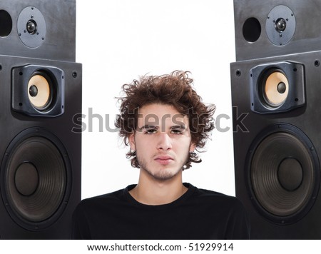 studio portrait of a caucasian young man listening to music on white backgroun