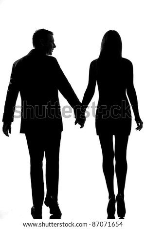 rear view one lovers caucasian couple man and woman walking hand in hand in studio silhouette isolated on white background