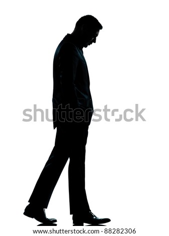 one caucasian business man walking silhouette Full length in studio isolated on white background