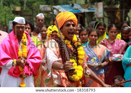 PANDHARPUR, INDIA - SEPT 13th, A tribal man dancing in a very rare marriage ritual with a sword in his hand.