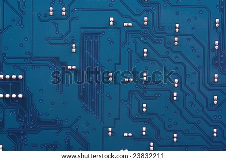 A background with a view of the connections(bus) on a blue circuit board of a soundcard.