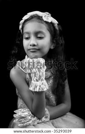A classic black & white, fairytale-like picture of a pouting sad Indian princess.