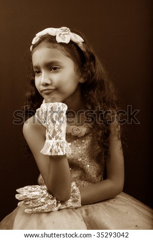 A classic fairytale like picture of a pouting sad Indian princess in sepia tone.