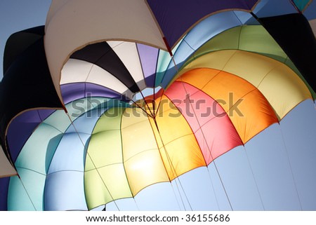 A background with an abstract view of a colorful parachute.