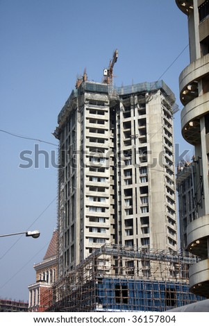 A tall building under construction in Mumbai, India.