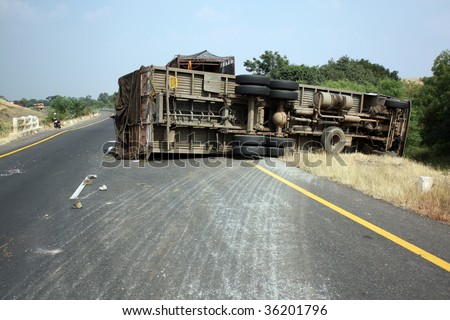 A view of an overturned truck on an highway in an accident.