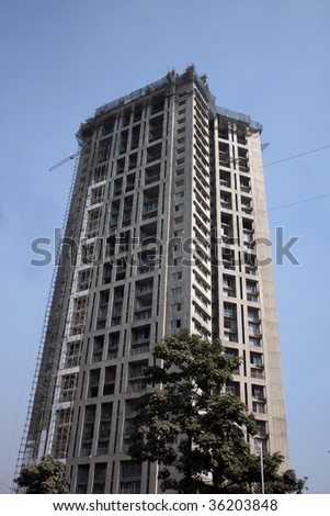 A tall skyscraper under construction in Mumbai, India.
