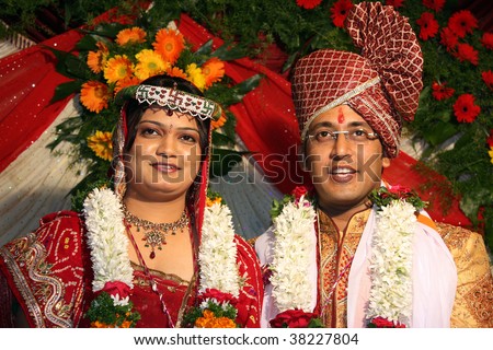 stock photo A portrait of an Indian wedding couple in their traditional 