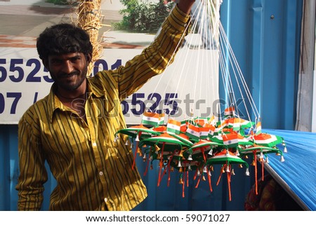 PUNE, MAHARASHTRA/INDIA August 15: A street-side peddler selling Indian flags decorations on the 64th Indian Independence Day on August 15, 2010 in Pune, Maharashtra, India.