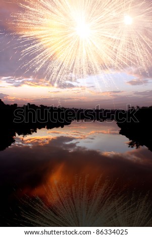 The beautiful fireworks over an Indian river at dawn, on the festive occasion of diwali.