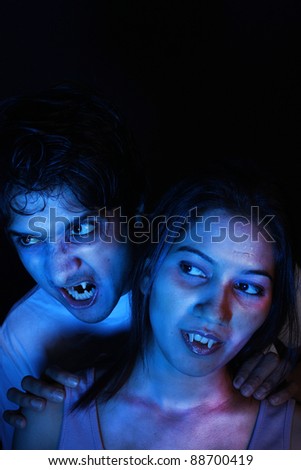 A portrait of an Indian vampire couple in the moonlight.
