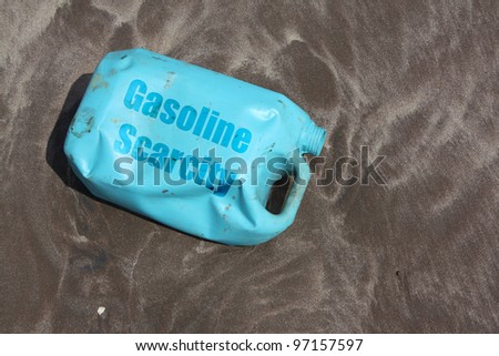 A can of petrol lies empty on the beach sands after gas stations go on strike in India.