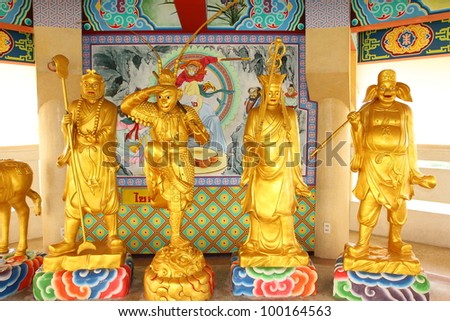 Chinese statue a priest and members of 