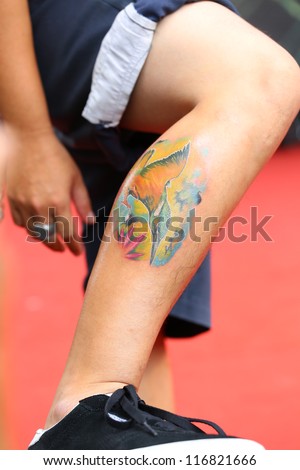 BANGKOK, THAILAND - OCTOBER 23 : Unidentified Thai people show old school tattoos at MBK Center on display \
