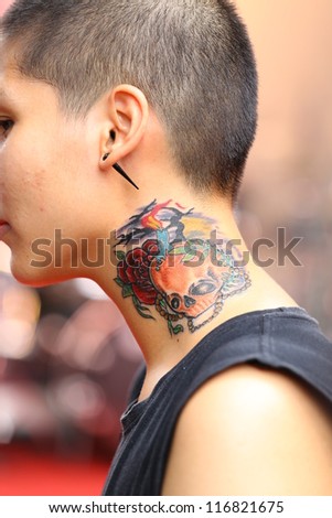 BANGKOK, THAILAND - OCTOBER 23 :Unidentified Thai people contest their old school tattoo at MBK Center on display 