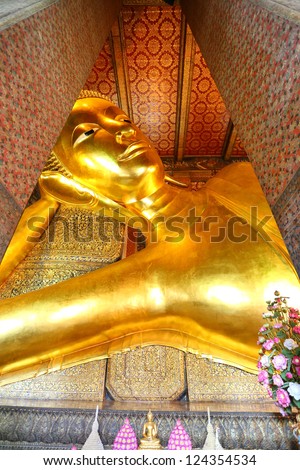 BANGKOK, THAILAND - JAN 8: Details Face of the Reclining Buddha statue at the Wat Pho temple on January 8, 2013 in Wat Pho temple, Bangkok,Thailand. The reclining Buddha is 15m high and 43m long.