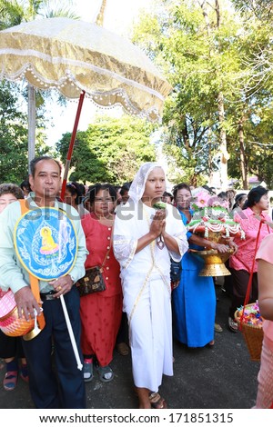 BANGKOK,THAILAND JANUARY 12 : Newly ordained Buddhist monk pray with priest procession. Newly ordained Buddhist monks have a ritual in the temple procession in Bangkok Thailand on January 12, 2014
