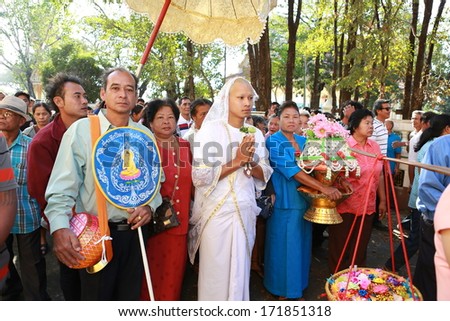 BANGKOK,THAILAND JANUARY 12 : Newly ordained Buddhist monk pray with priest procession. Newly ordained Buddhist monks have a ritual in the temple procession in Bangkok Thailand on January 12, 2014