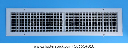White air vent on blue wall